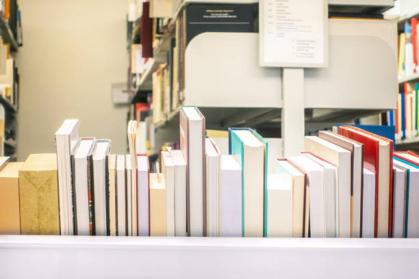 istock Books in the library by the window 1126879271