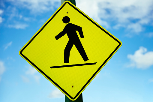 Traffic control sign with Crossing guard, background with copy space, full frame horizontal composition