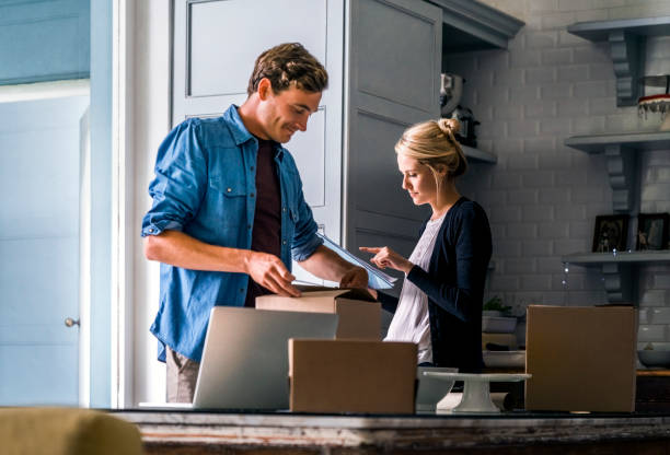 istock Couple preparing Christmas presents at home 1126880570