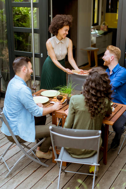 istock Cheerful young people have lunch in the courtyard and have a fun 1126880744