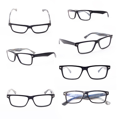 Set of rectangular black-rimmed glasses are view from above.  Isolated on a light background.
