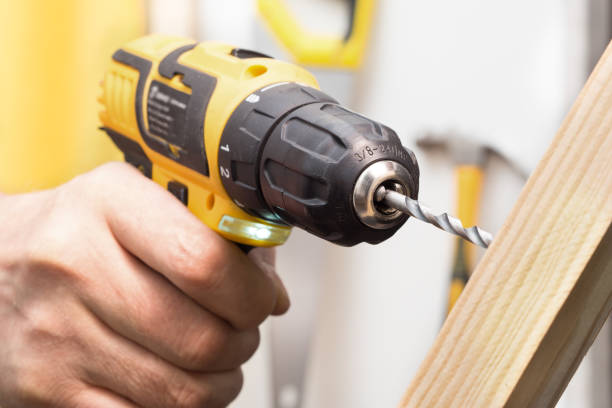 istock the drill drills into the wood 1126882736