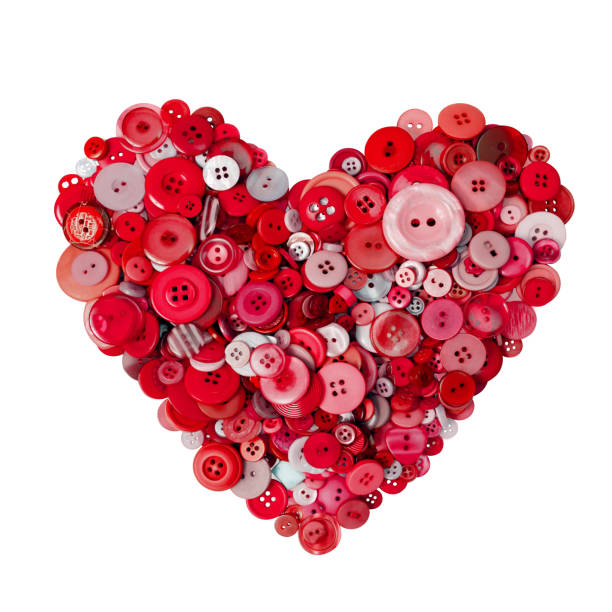 istock Red heart made with many buttons on a white background. 1126882774