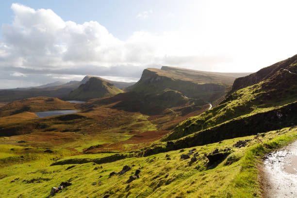 istock Hiking path at Quiraing with panorama view of Skye and its impressive mountains during a sunny autumn day (Isle of Skye, Scotland, Europe) 1126882837