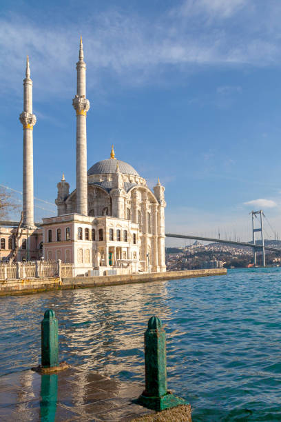 istock Ortakoy Mosque known also as Mecidiye Mosque, with the Bosphorus Bridge connecting European continent to Asian continent, in the background, in Istanbul, Turkey 1126882895