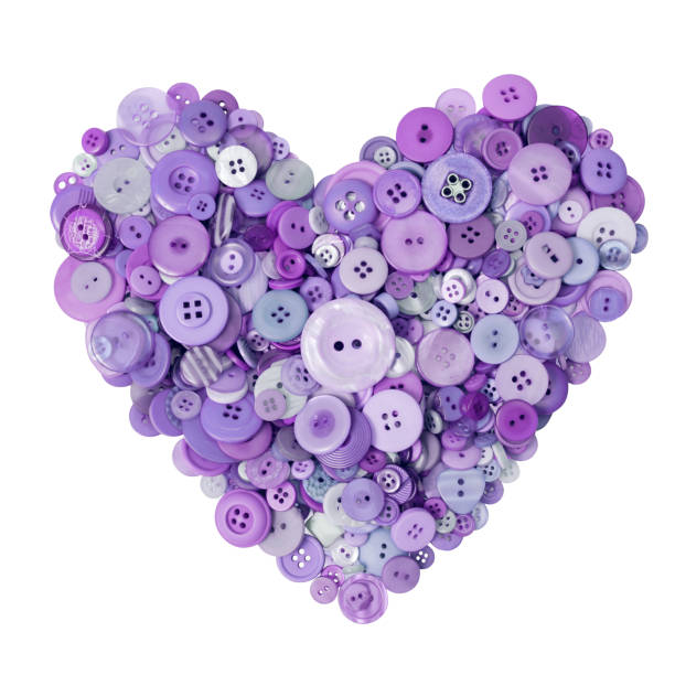 istock Lilac heart made with many buttons on a white background 1126883079