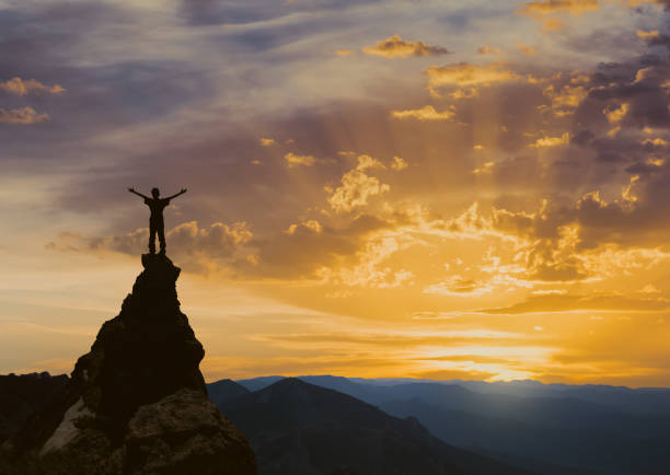 istock man on the top of a rock 1126883133