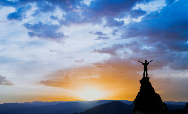 istock man on the top of a rock 1126883145