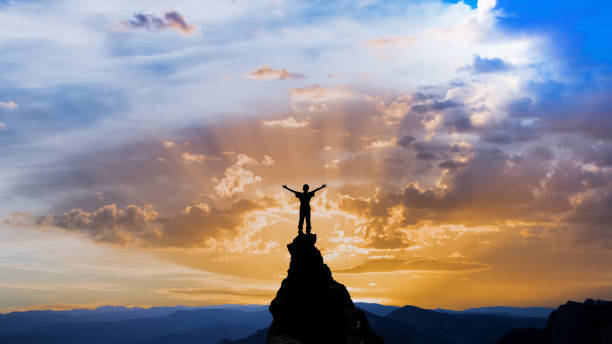 istock man on the top of a rock 1126883155