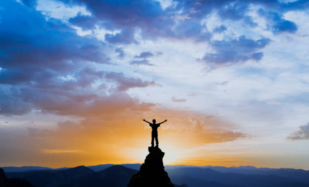 istock man on the top of a rock 1126883156