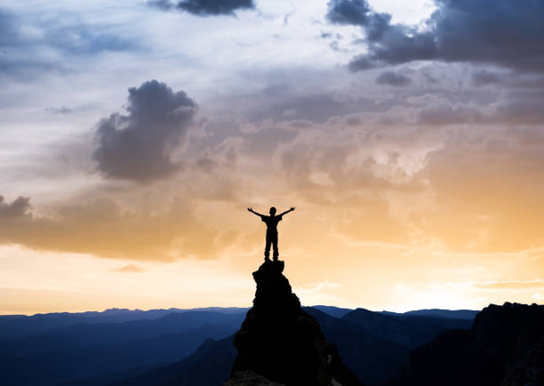 istock man on the top of a rock 1126883160