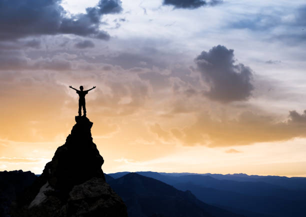 istock man on the top of a rock 1126883165