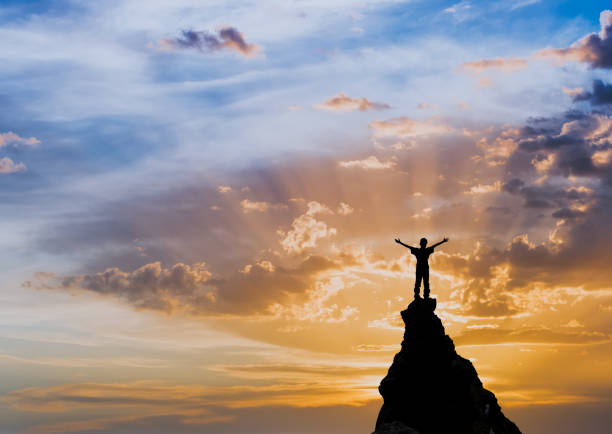 istock man on the top of a rock 1126883172