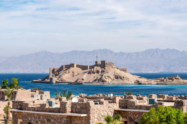 Ancient military fort Salah El Din Citadel on a small island on the shores of the Red Sea Ancient military fort Salah El Din Citadel on a small island on the shores of the Red Sea taba stock pictures, royalty-free photos & images