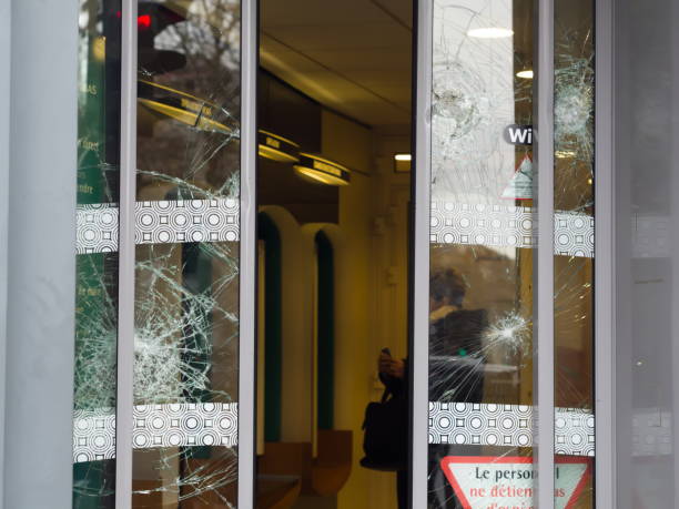 istock Broken window of a bank after the yellow vests movement - 2 1126884697