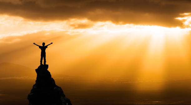 istock man on the top of a rock 1126886179