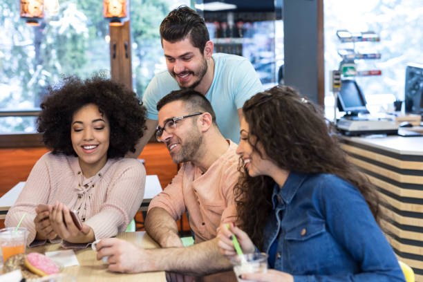istock Friends enjoying time together in cafe 1126887660