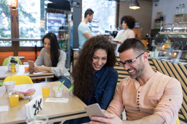 istock Couple in love having breakfast and social networking 1126887663