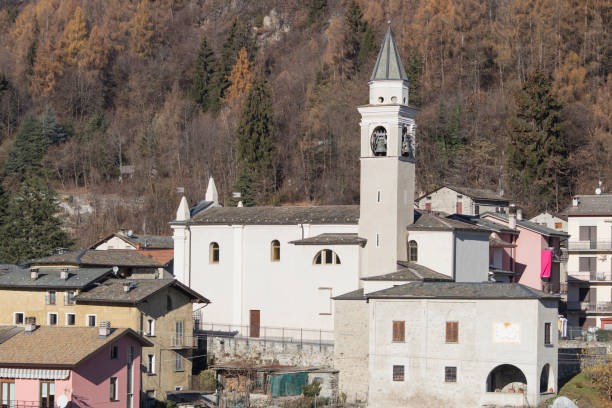 istock Church in a coutryside with many houses and trees composition 1126894690