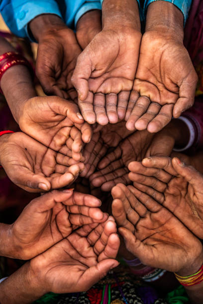 istock Hands of poor - asking for help, Africa 1126896410