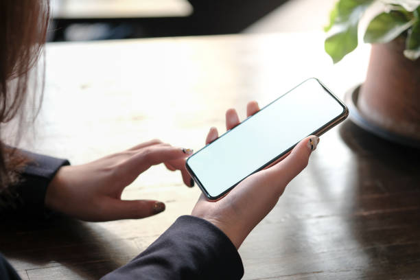 istock Women's hands holding cell telephone blank copy space screen. smart phone with technology concept. 1126898801