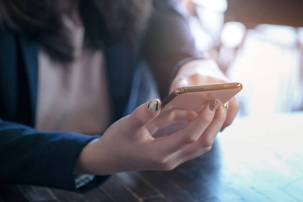 istock Women's hands holding cell telephone blank copy space screen. smart phone with technology concept. 1126898802