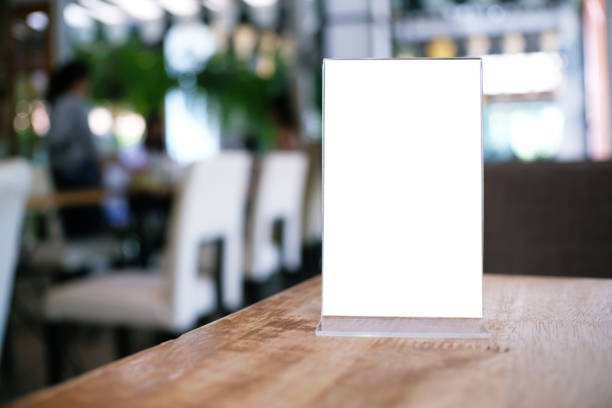 istock Menu frame standing on wood table in Bar restaurant cafe. space for text marketing promotion. 1126898832