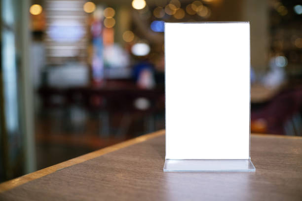 istock Menu frame standing on wood table in Bar restaurant cafe. space for text marketing promotion. 1126898837
