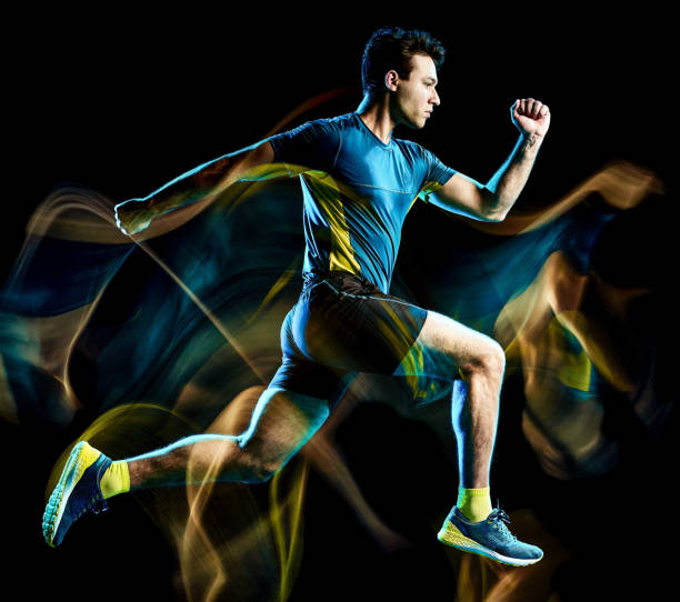 istock runner running jogger jogging man isolated light painting black background 1126899129