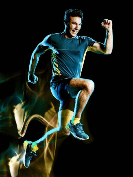 istock runner running jogger jogging man isolated light painting black background 1126899132