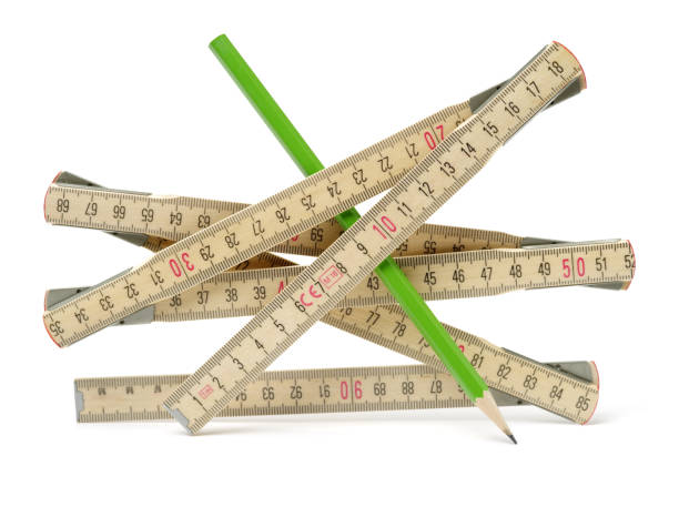 istock Measure and pencil workshop on the white table. It is a woodworking workshop tool. White background 1126900673