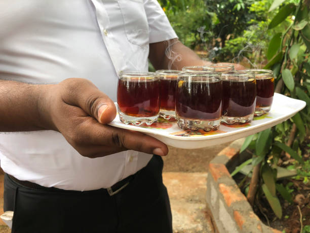 istock a man serving hot herbal tea on a tray 1126900842