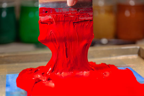 istock red color dripping from hand screen printing 1126905597
