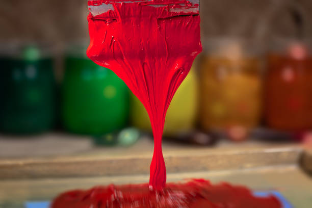 istock red color dripping from hand screen printing 1126905602