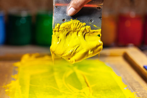 istock yellow color dripping from hand screen printing 1126905646