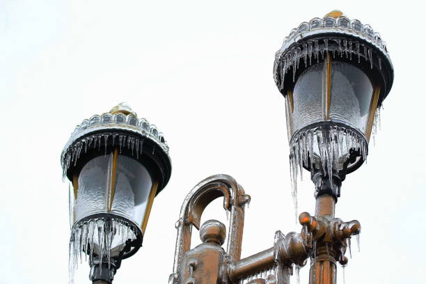 Bucharest, Romania - January 27, 2019: A street lamp is covered with ice after an winter ice storm, in Bucharest, Romania.