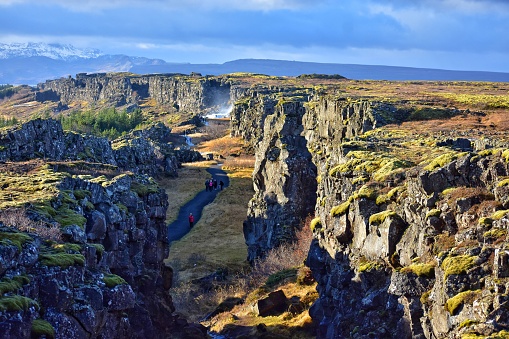 path among tectonic plates to oxararfoss waterfall in iceland in thingvellir national park - autumn landscape on golden circle route