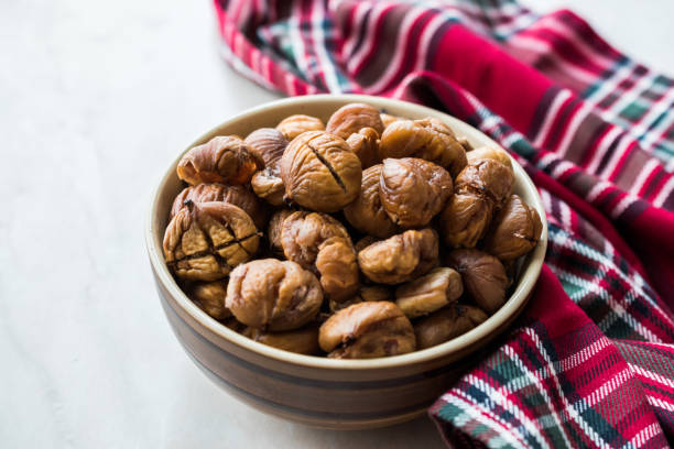 istock Peeled Roasted Raw Organic Chestnuts in Bowl. 1126907916