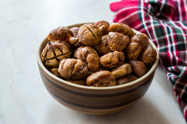 istock Peeled Roasted Raw Organic Chestnuts in Bowl. 1126908144