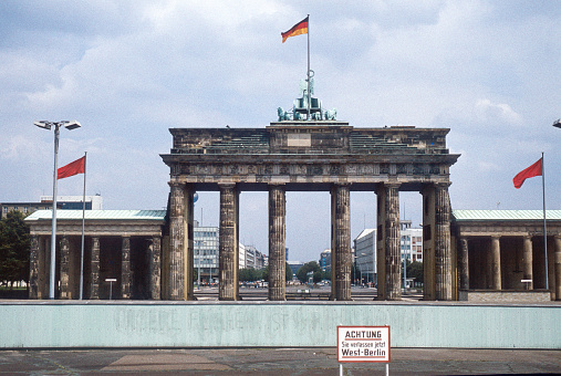 Historic image from July 1980: A look from West Berlin over the Berlin wall to Brandenburg Gate and East Berlin. Sign with 