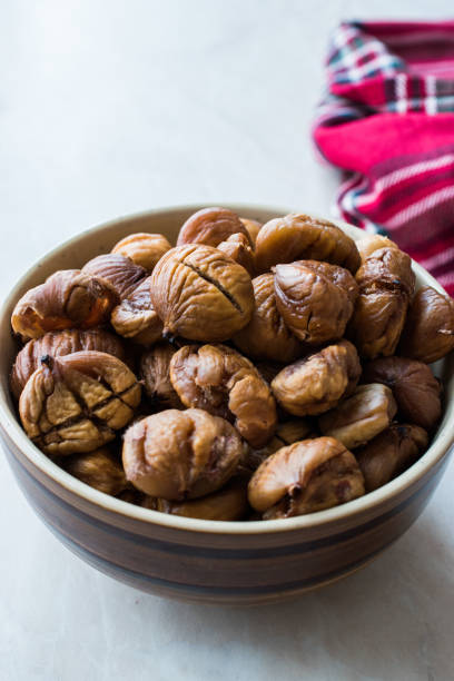 istock Peeled Roasted Raw Organic Chestnuts in Bowl. 1126914023