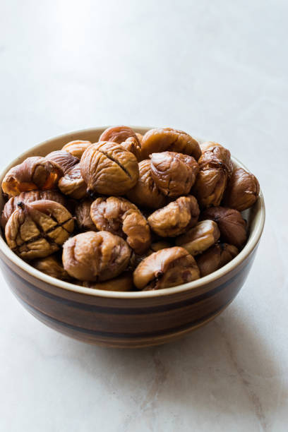 istock Peeled Roasted Raw Organic Chestnuts in Bowl. 1126914163