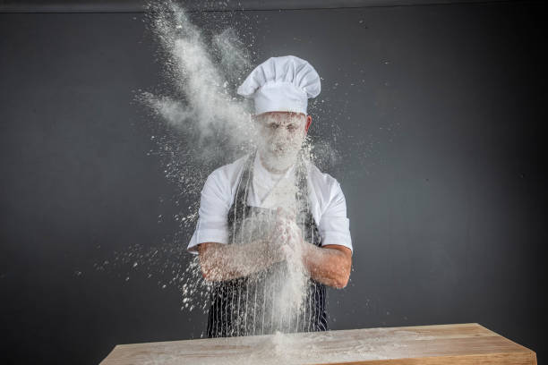 istock chef in chef's whites covered in flour 1126916595