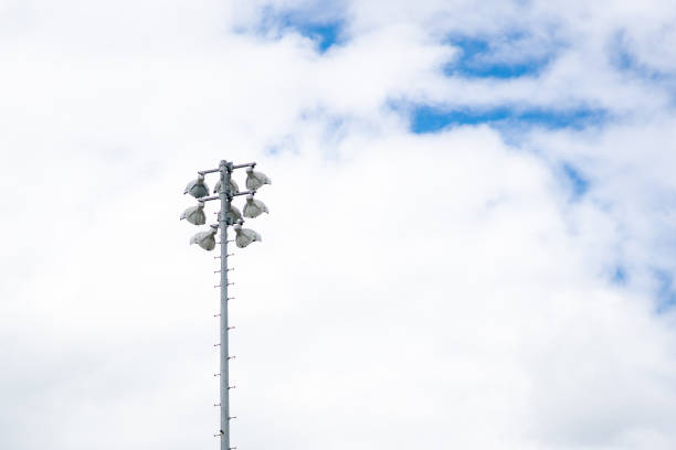 Sport light lamp pole on blue sky and cloud