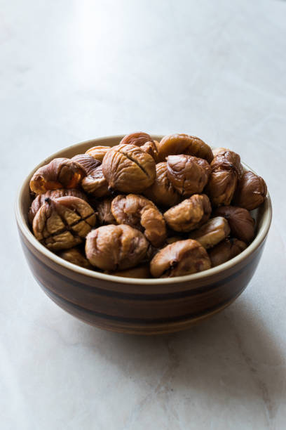 istock Peeled Roasted Raw Organic Chestnuts in Bowl. 1126918764