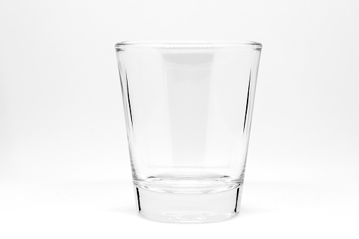 Transparent plastic cup isolated on white background with a little reflection.