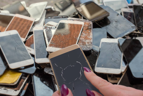 istock She tries her broken phone above a stack of phones 1126920419