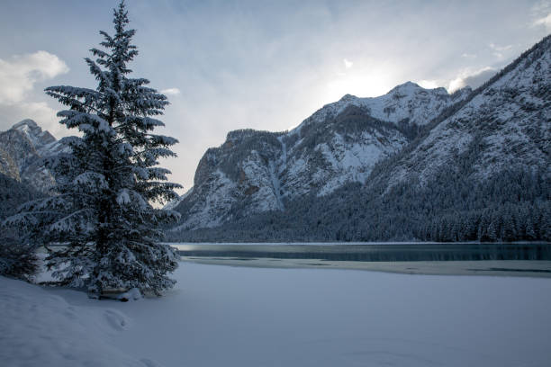 istock Snow at the frozen mountain lake 1126922058
