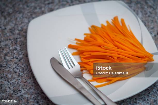 A Plate Of Carrots With Silver Spoon And Fork Stock Photo - Download Image Now - Carrot, Colombia, Cooking