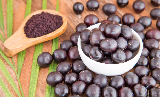 istock Acai powder and berries - Euterpe oleracea 1126922822